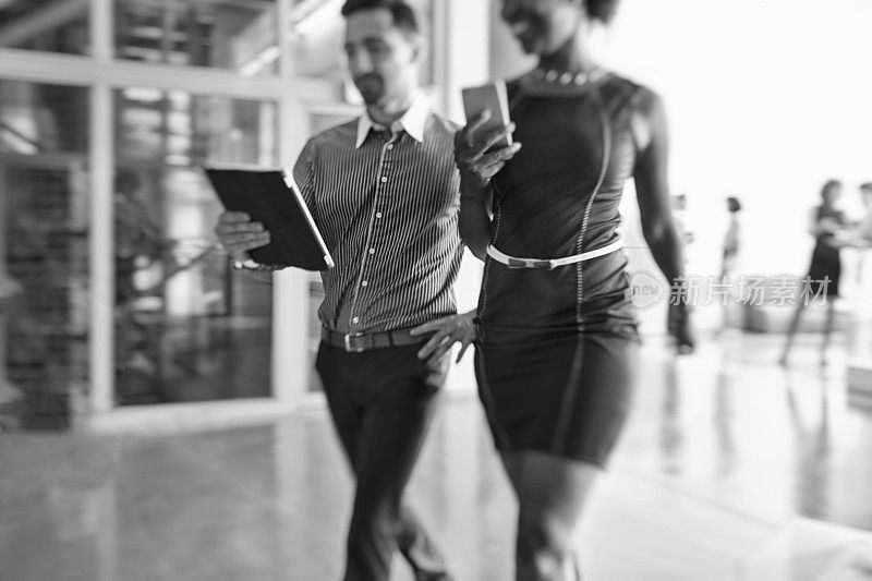 Group of business people walking in the office building